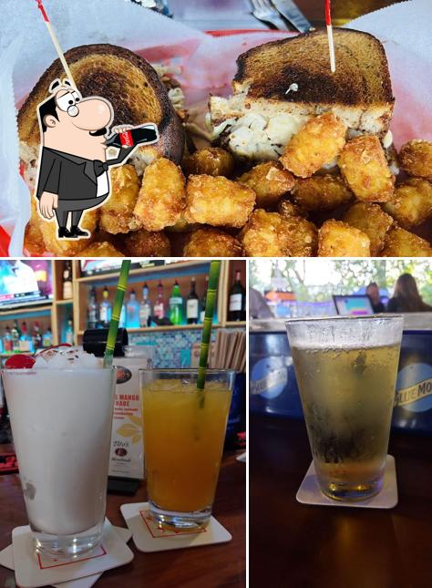 The photo of Johnny Mangos Tiki Bar & Grill’s drink and food