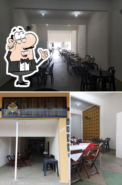 O interior do Que Delicia Churrascaria e Pizzaria