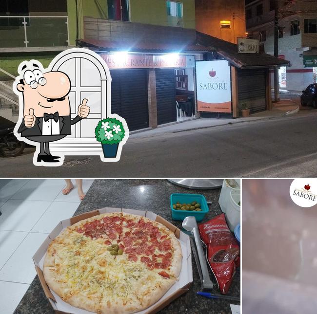 Confira a foto mostrando exterior e pizza no Mix Tasty