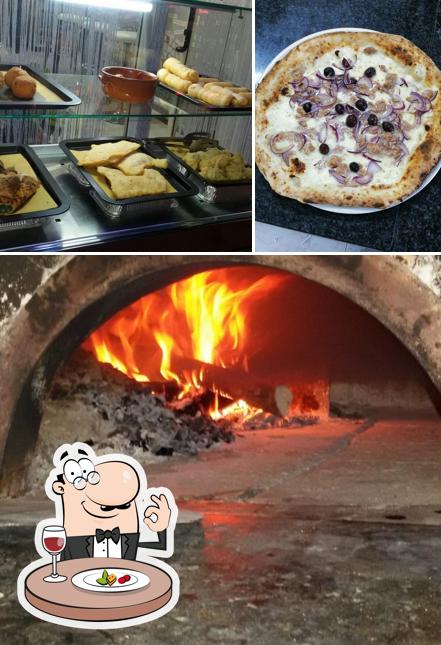Tra le diverse cose da Pizzeria Arco Adriano si possono trovare la cibo e interni