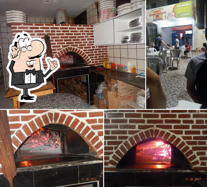 O interior do Pizzaria Casa Massas