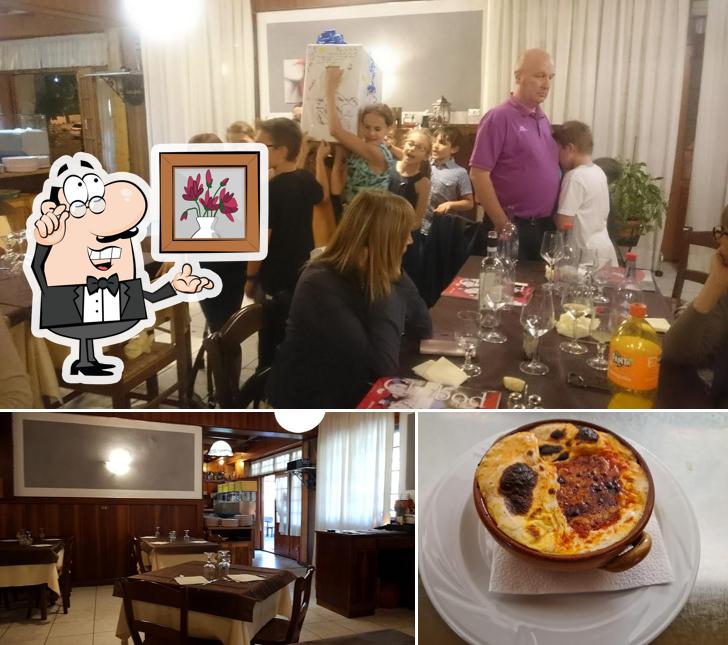 La foto di interni e pizza da La Maison de Pierre