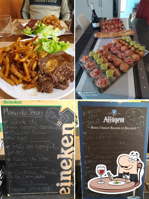 Take a look at the photo depicting food and blackboard at Le Guez't