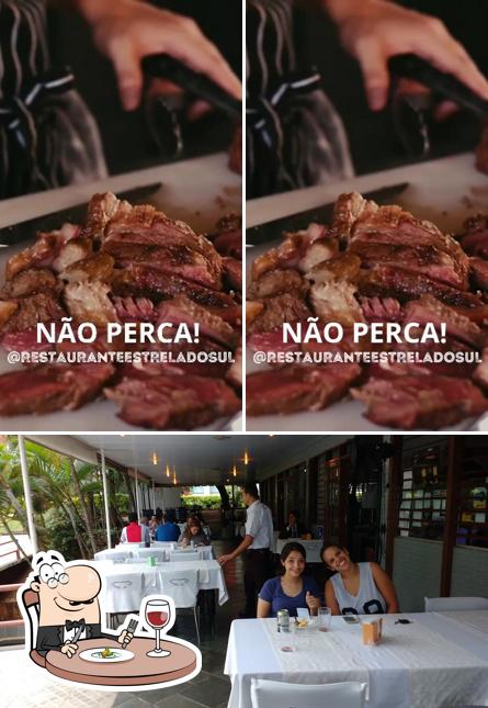 A imagem do Restaurante Estrela do Sul’s comida e interior