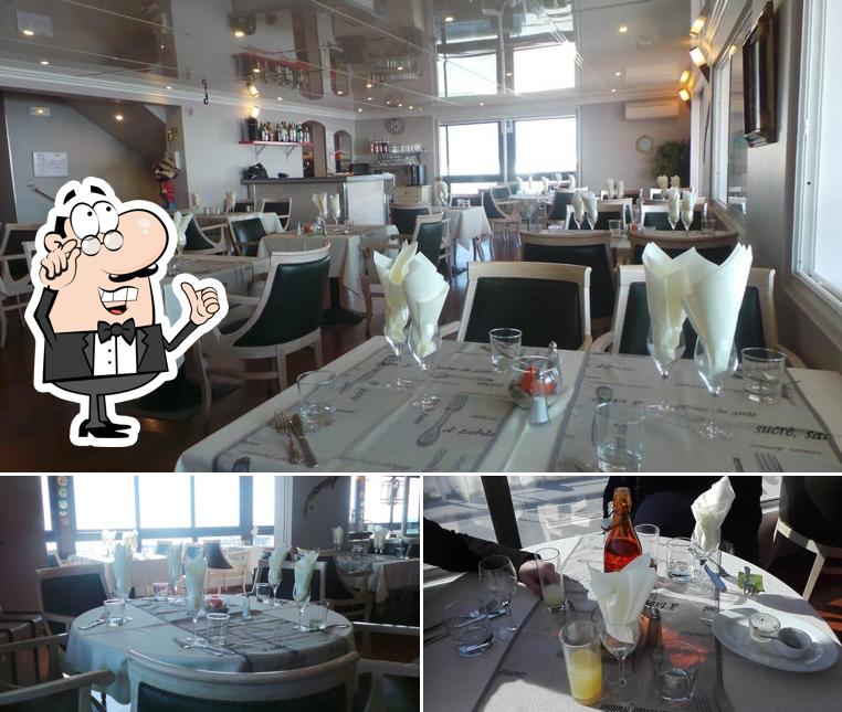 Parmi les différentes choses de la intérieur et la table à manger, une personne peut trouver sur Côte et Mer - Restaurant Carro