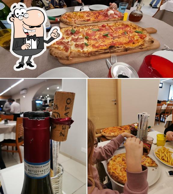 La photo de la intérieur et pizza de Pizzeria Bella Napoli di Borgo Roma - Verona’s