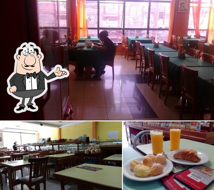 Esta é a foto mostrando interior e mesa de jantar a Confeitaria e Restaurante Branca