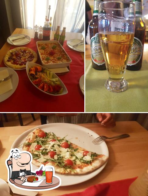 Parmi les différentes choses de la table à manger et la bière, une personne peut trouver sur Peperoncino Pula