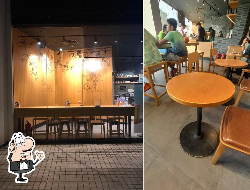 Take a seat at one of the tables at Starbucks Coffee