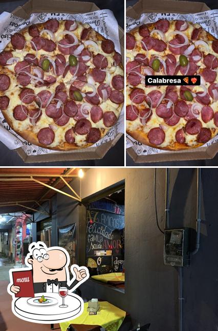 Entre diferentes coisas, comida e interior podem ser encontrados a Pizzaria vikings cidade nova