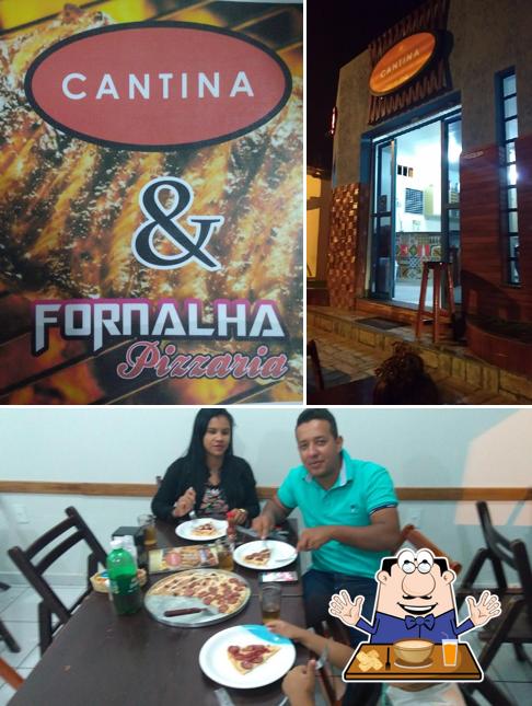A Cantina Fornalha Pizzaria se destaca pelo comida e mesa de jantar