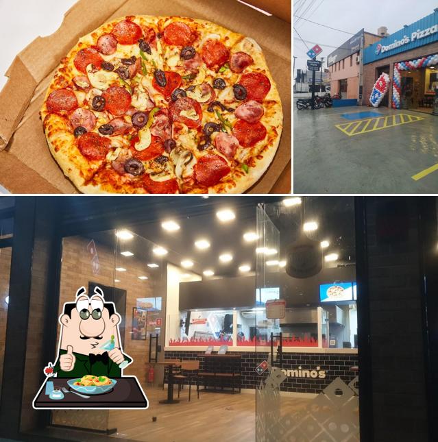 Entre diferentes coisas, comida e exterior podem ser encontrados no Domino's Pizza - Itu Brasil