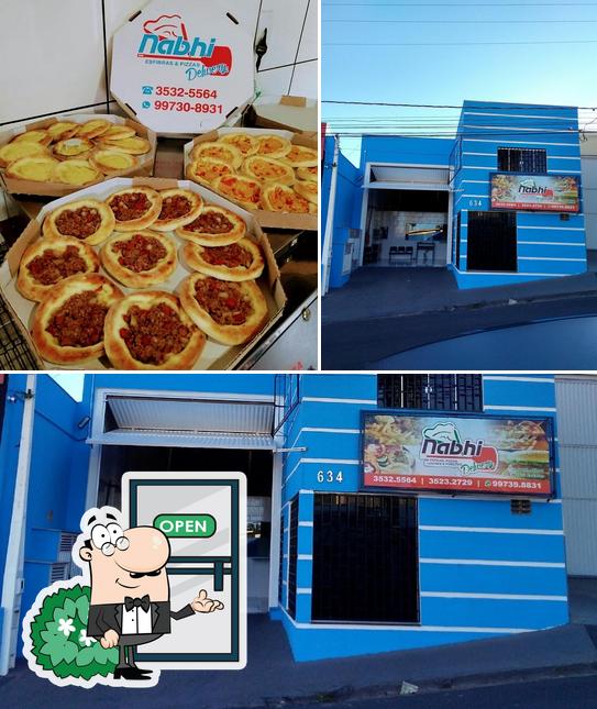 Entre diversos coisas, exterior e pizza podem ser encontrados no Nabhi esfiha pizzaria lanches e porções