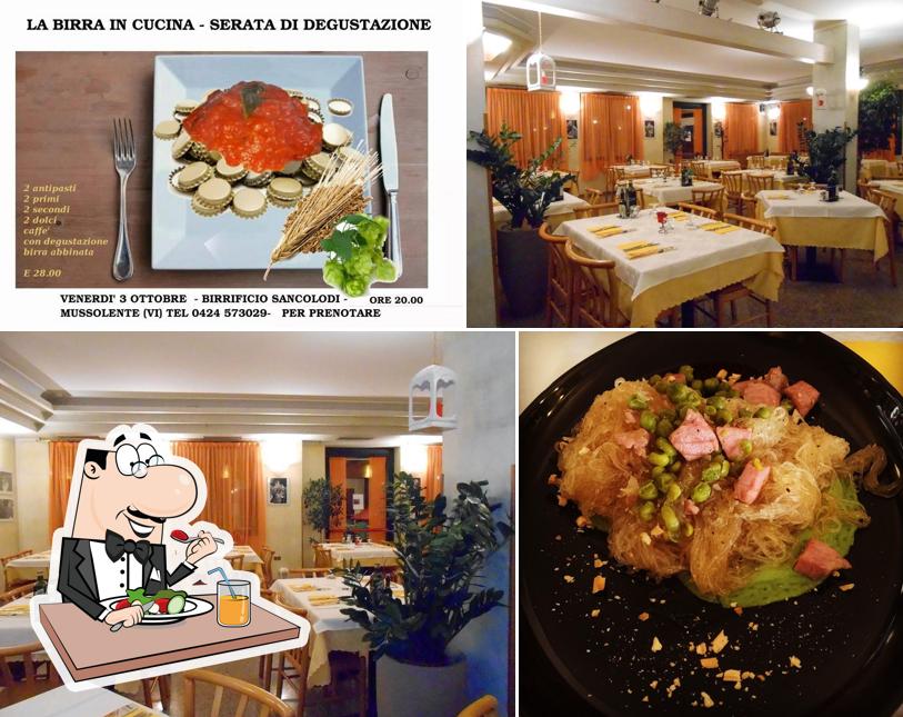 La foto della cibo e tavolo da pranzo di Pizzeria Birrificio Ristorante Sancolodi