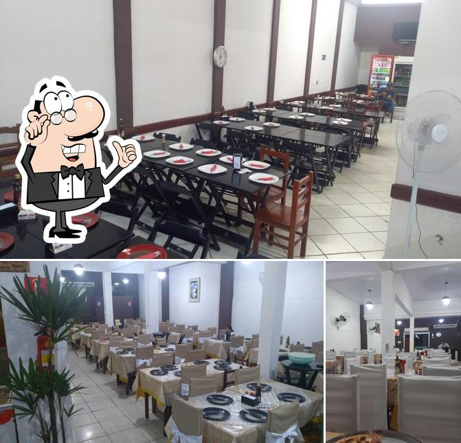 O interior do Pizzaria E Lanchonete Tropical