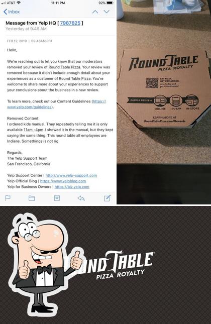 Look at the picture of Round Table Pizza