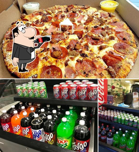 Check out the image showing drink and pizza at Pope's Pizzeria