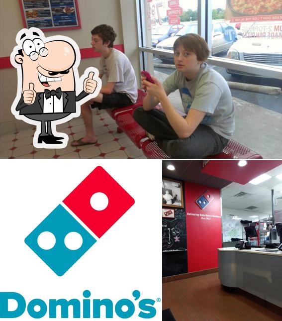 Взгляните на изображение пиццерии "Domino's Pizza"