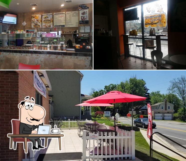 Take a seat at one of the tables at YOG Frozen Yogurt, Crepes, and More