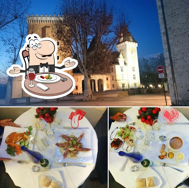 Voici l’image représentant la table à manger et extérieur sur Restaurant le Saint-Jacques Pau