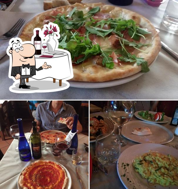 Voici l’image représentant la table à manger et pizza sur Ristorante Pizzeria Dante