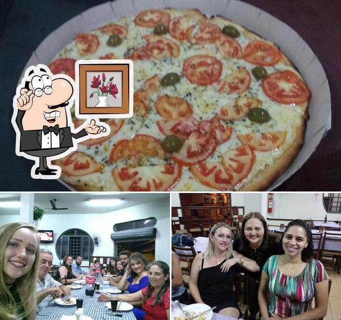 A ilustração do Pizzaria Sufoco’s interior e pizza