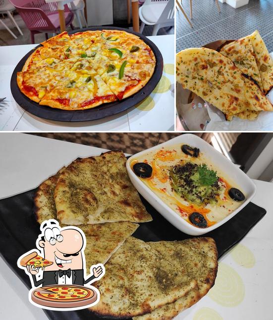 Try out pizza at Dhamaal - The Desi Kitchen