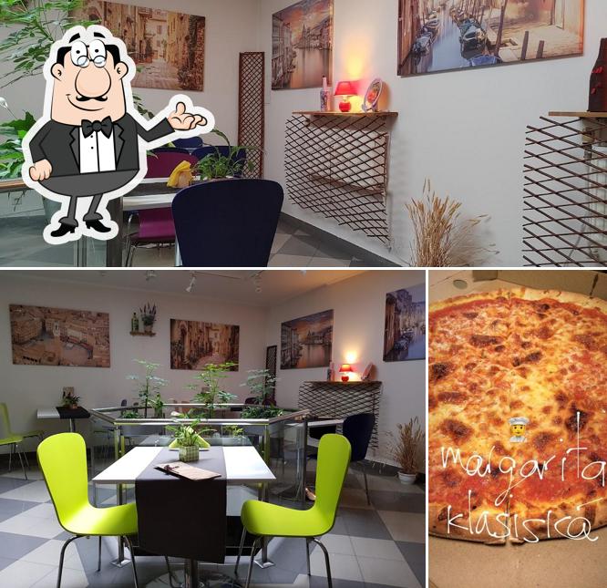 This is the image showing interior and pizza at L'Acquerello