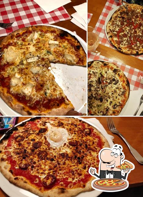 Prenez des pizzas à pizzeria l'Aroma