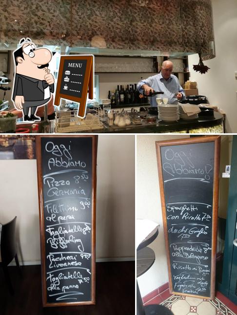 This is the image depicting blackboard and interior at Pizzeria Italia