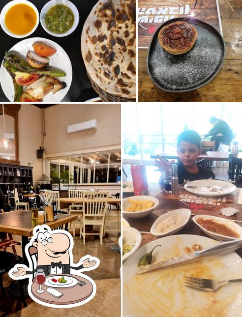 Take a look at the photo displaying dining table and food at שיפודי הטאבון