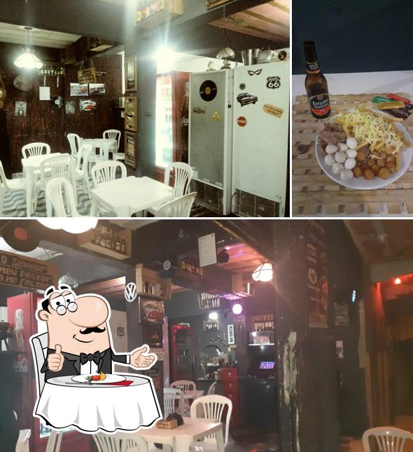 Entre diversos coisas, mesa de jantar e cerveja podem ser encontrados a Império Kansas Mini Pizza & Cia