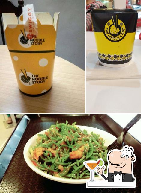 Take a look at the photo showing drink and food at The Noodle Story , DCN Mall
