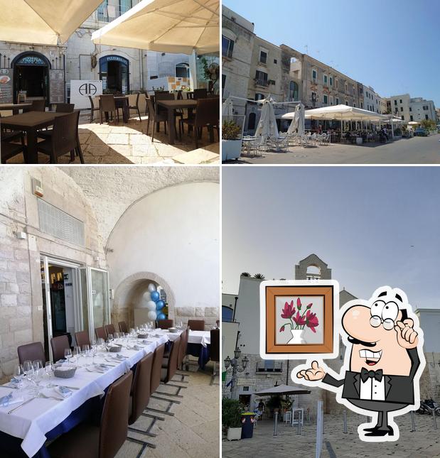 Check out the picture showing interior and exterior at Al Porto Osteria Pizzeria