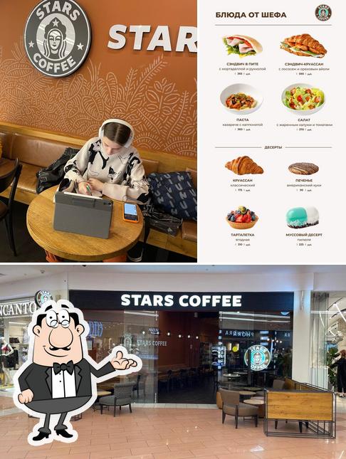 Это снимок, где изображены внутреннее оформление и бургеры в Stars Coffee