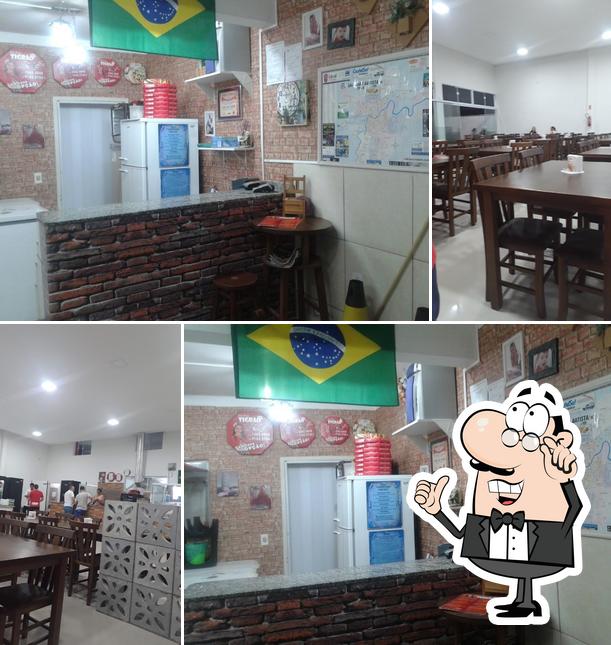 O interior do PizzariaTigrão