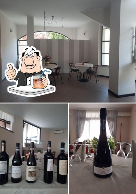 Dai un’occhiata alla foto che raffigura la bevanda e tavolo da pranzo di Ristorante pizzeria Cristal