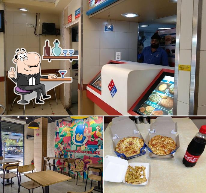 This is the picture displaying interior and beer at Domino's Pizza