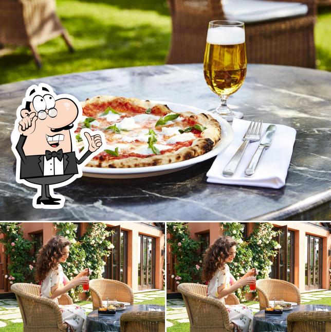 Guarda la immagine che raffigura la interni e pizza di La Dolce Brasserie