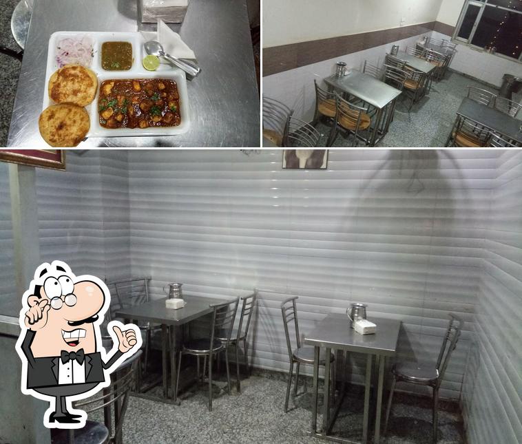 Check out the picture showing interior and dessert at Harmel Vaishno Dhaba
