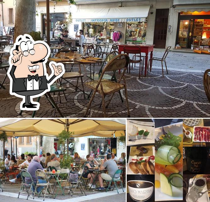 Dai un’occhiata alla immagine che raffigura la interni e cibo di Enoteca Pisacane • Vini & Tapas