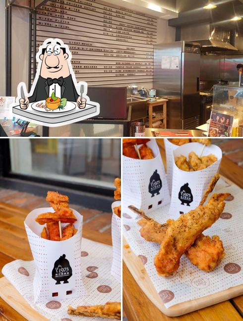 Check out the photo showing food and interior at J&G Fried Chicken