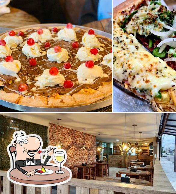 Dê uma olhada a foto apresentando comida e interior no Pizzaria das Famílias Pinhais