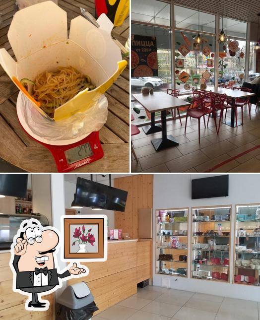 Фото, на котором видны внутреннее оформление и еда в Суши Wok