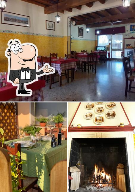 Siediti a un tavolo di Trattoria Al Piccolo Fogolar