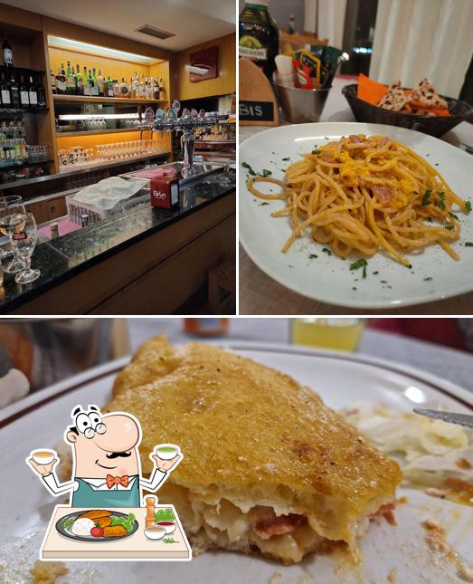 Check out the picture showing food and wine at Pizzeria Vesuvio