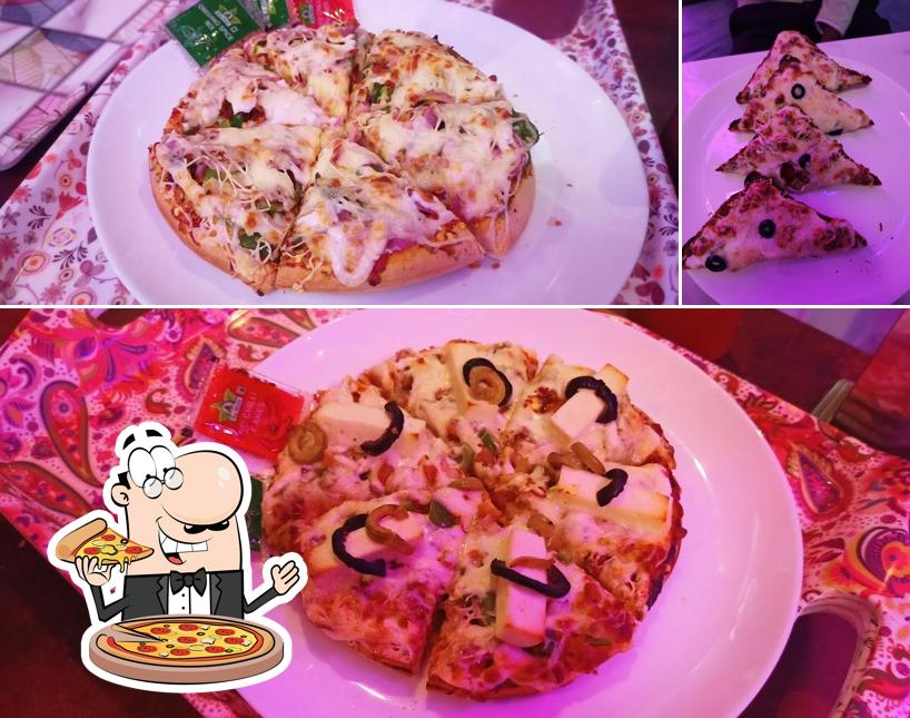 Get pizza at INSTA CAFE