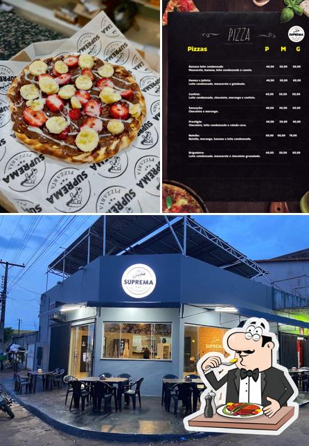 Entre diversos coisas, comida e exterior podem ser encontrados a Suprema Pizzaria