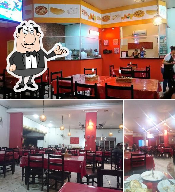 O interior do Brasa Ville Pizzaria