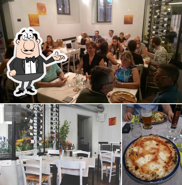 Dai un’occhiata alla foto che mostra la interni e tavolo da pranzo di Civico Uno Food e Pizza